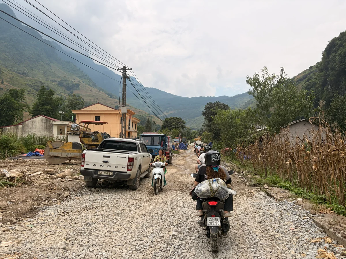 Gravel roads with motorbikes passing by other vehicles