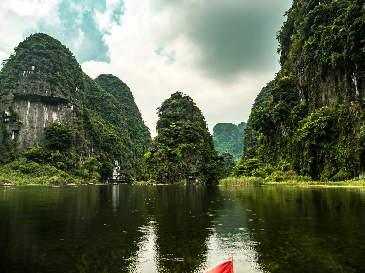 Karst mountains with moody skies over the water