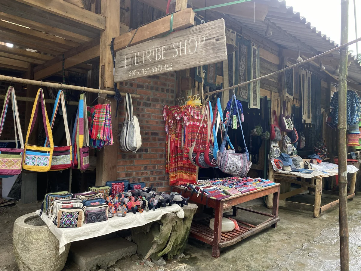 Items hang from a wooden market stall
