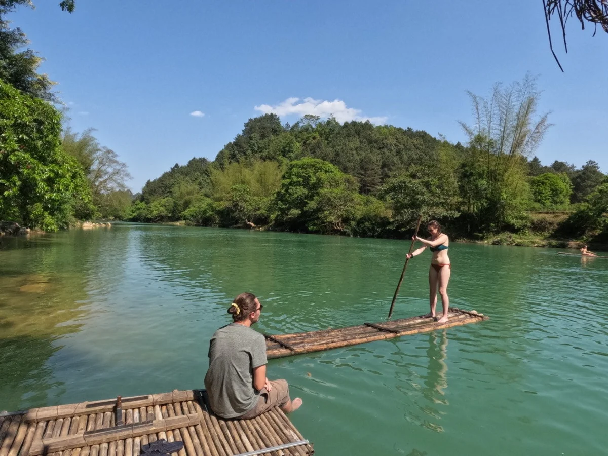 Couple enjoy the bamboo raft in Ha Giang