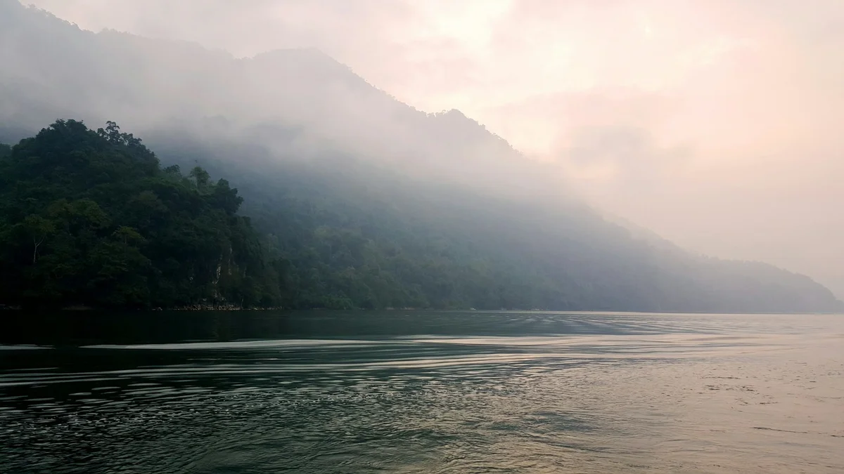 Lake with mist and mountains