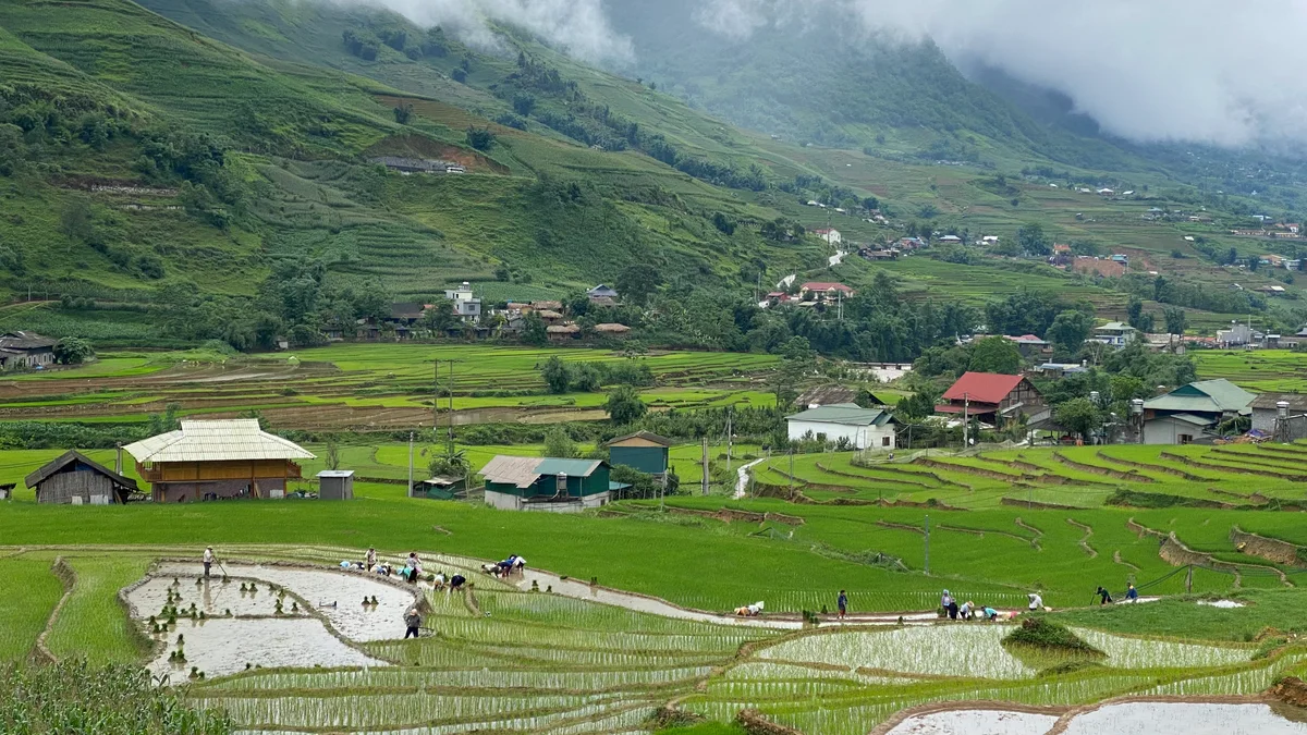 Village houses nestled in a valley of Sapa