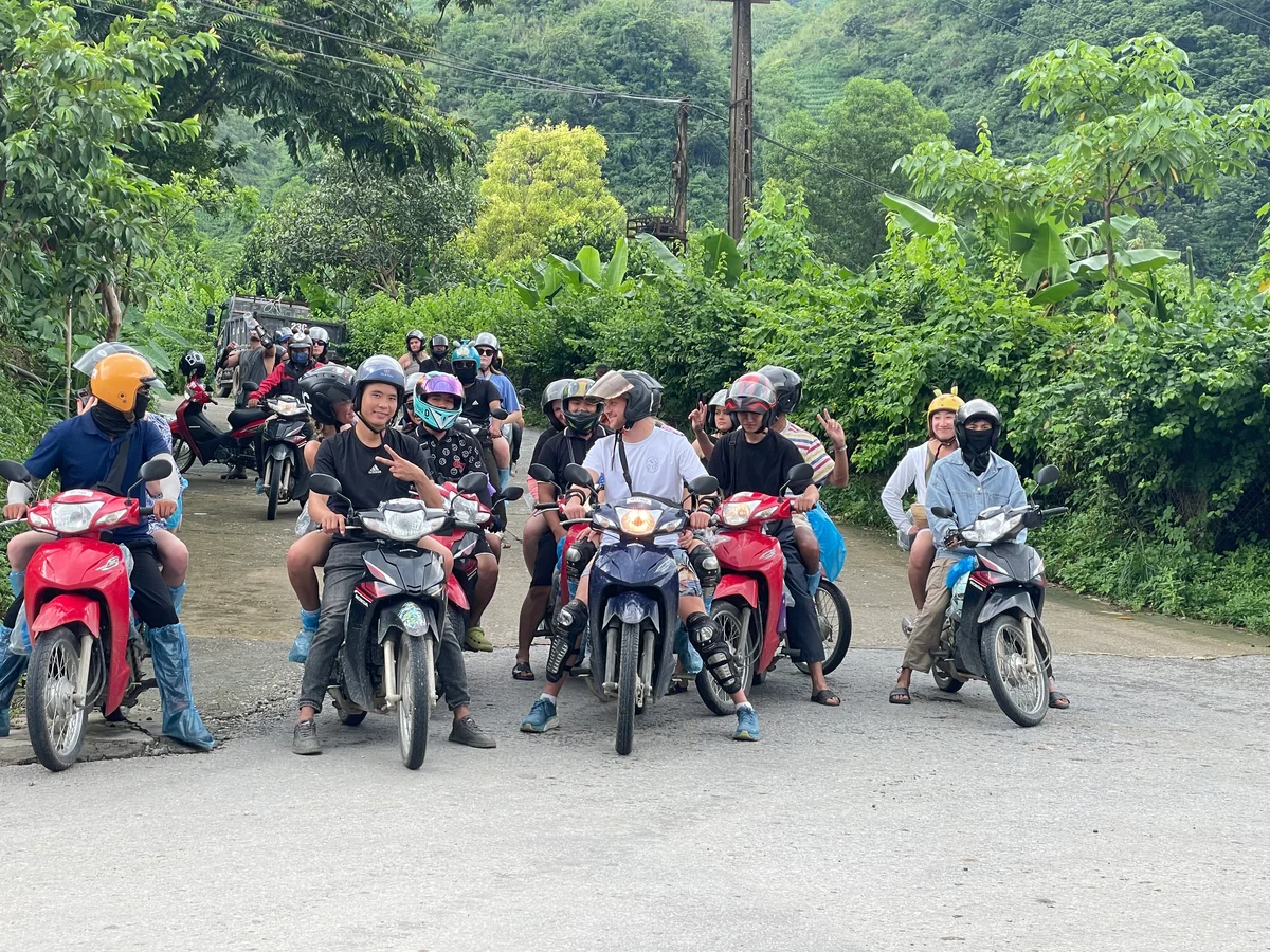 A group of motorbikers smile at the camera