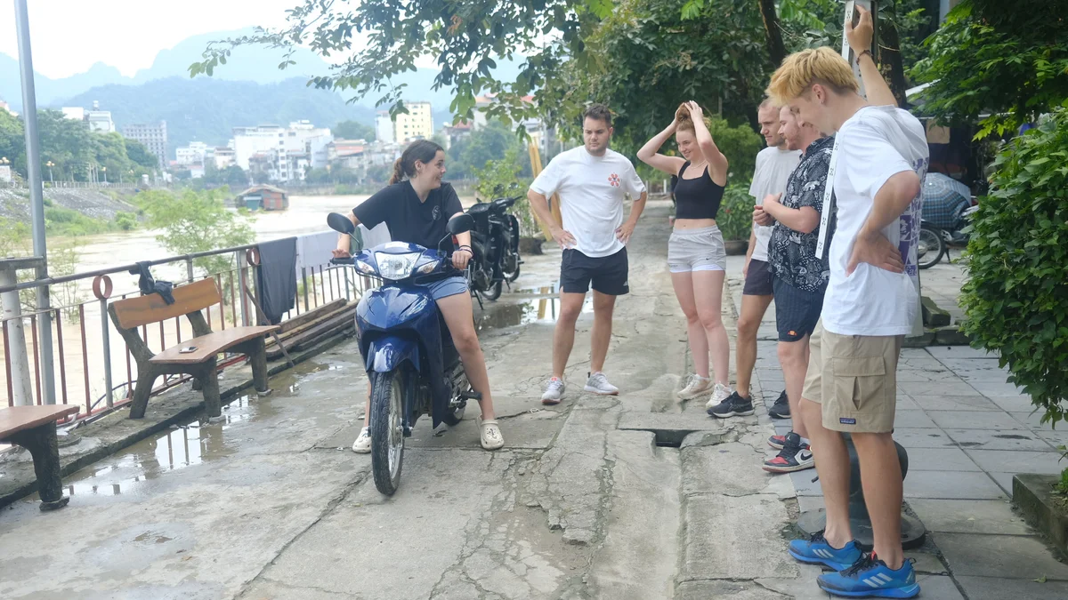 Bong Hostel teaching first-time riders how to ride a motorbike