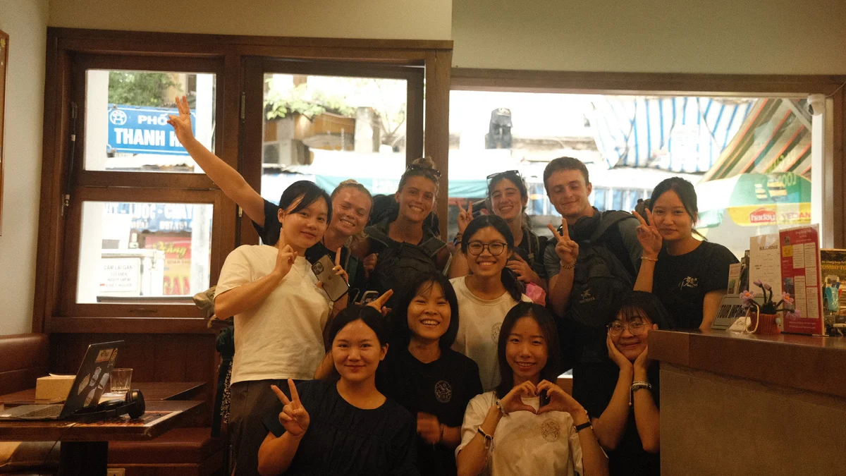 A group of Bong Hostel guests and staff pose 