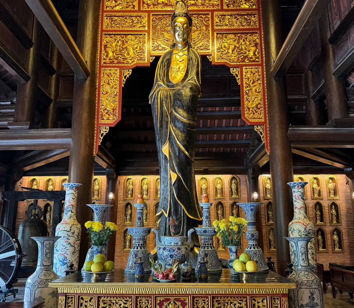 Temple and vases surrounding statue