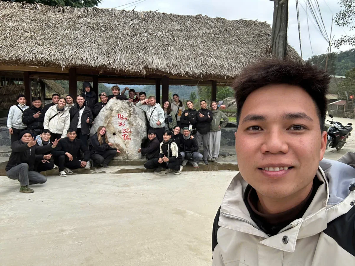 Guests and easy riders pose for a picture in Ha Giang