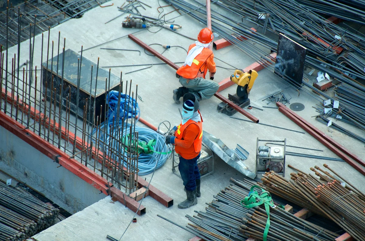 Two construction workers working on Cat Ba Island
