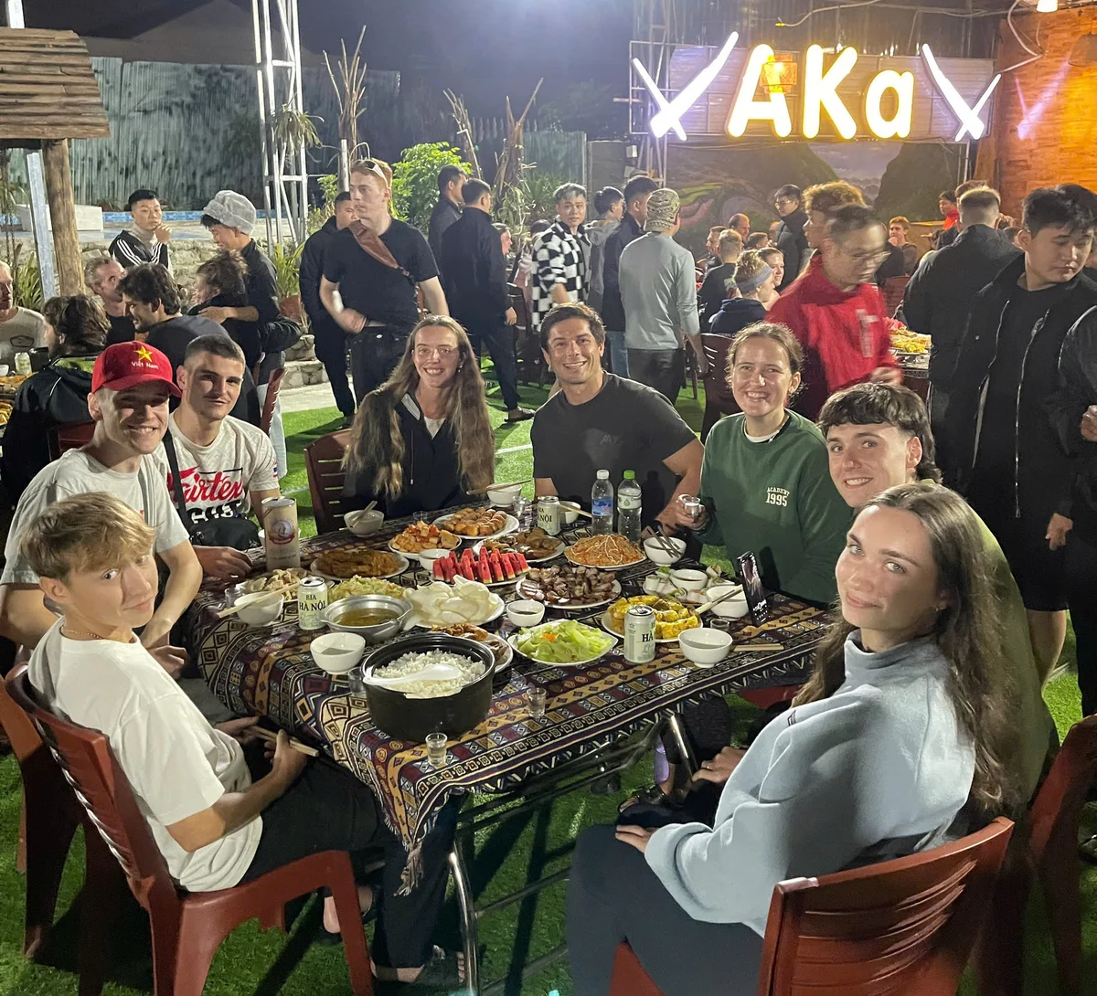 Bong Hostel group tour enjoying family-style dinner on the Ha Giang Loop
