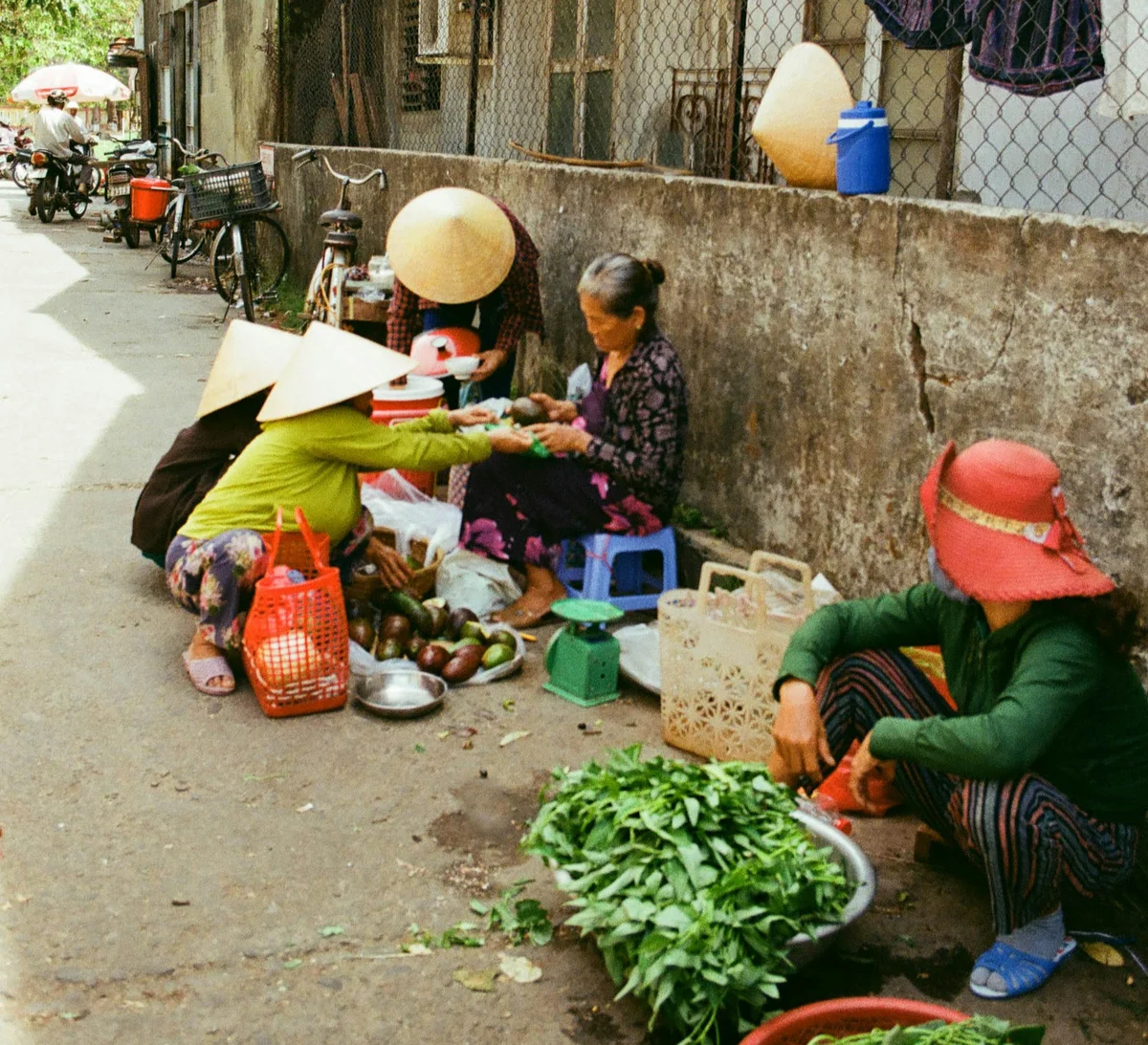 Street vendors sitting on the street in Vietnam
