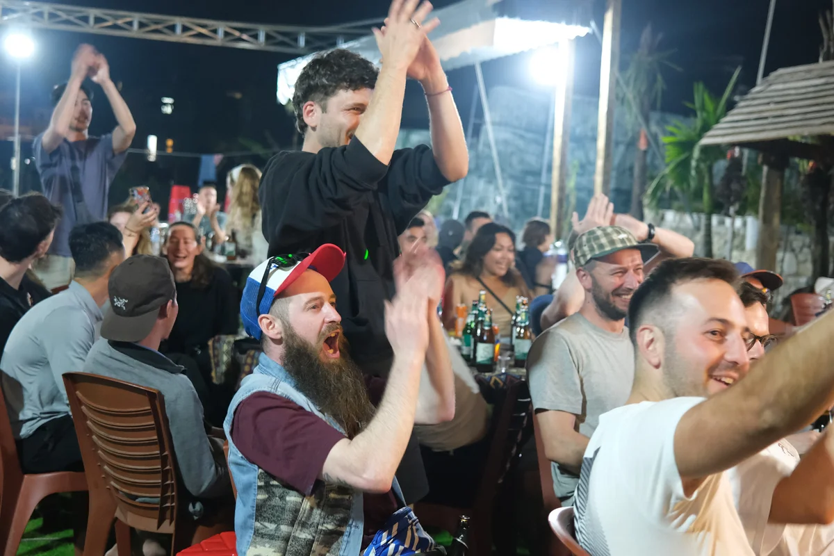 Bong Hostel guests clap for karaoke on the Ha Giang Loop