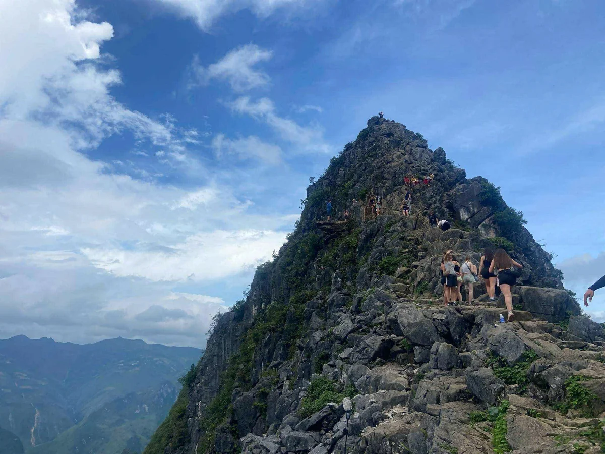 Group of people climb the skypath on the Ha Giang Loop