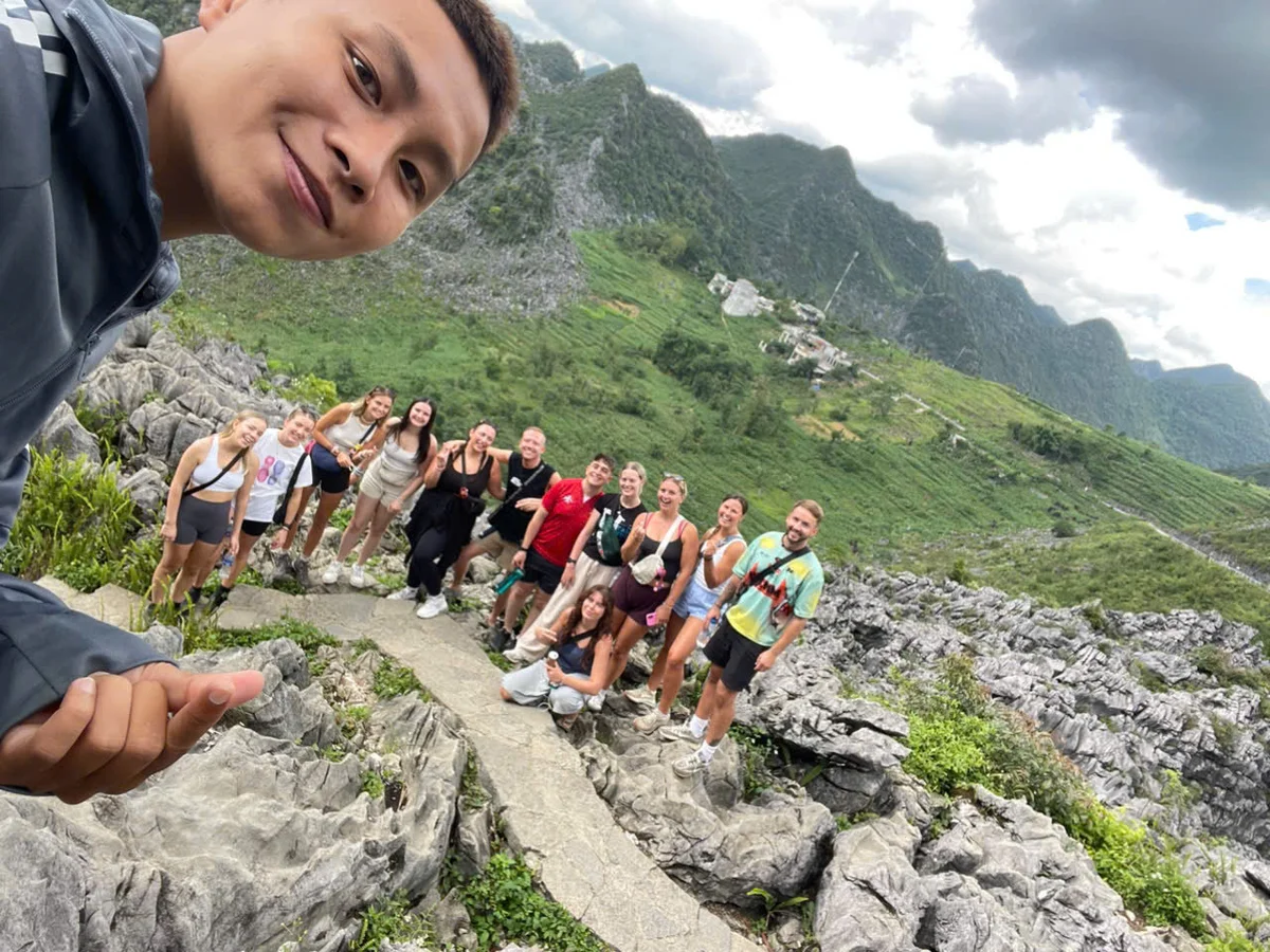 Guests and Ha Giang Loop Easy Rider pose for a group selfie