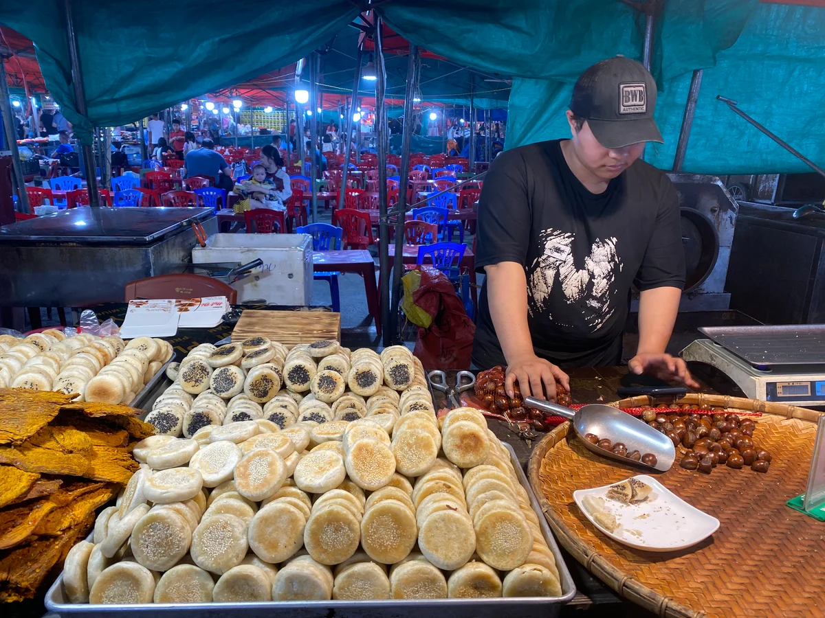 A man prepares goods at a local market