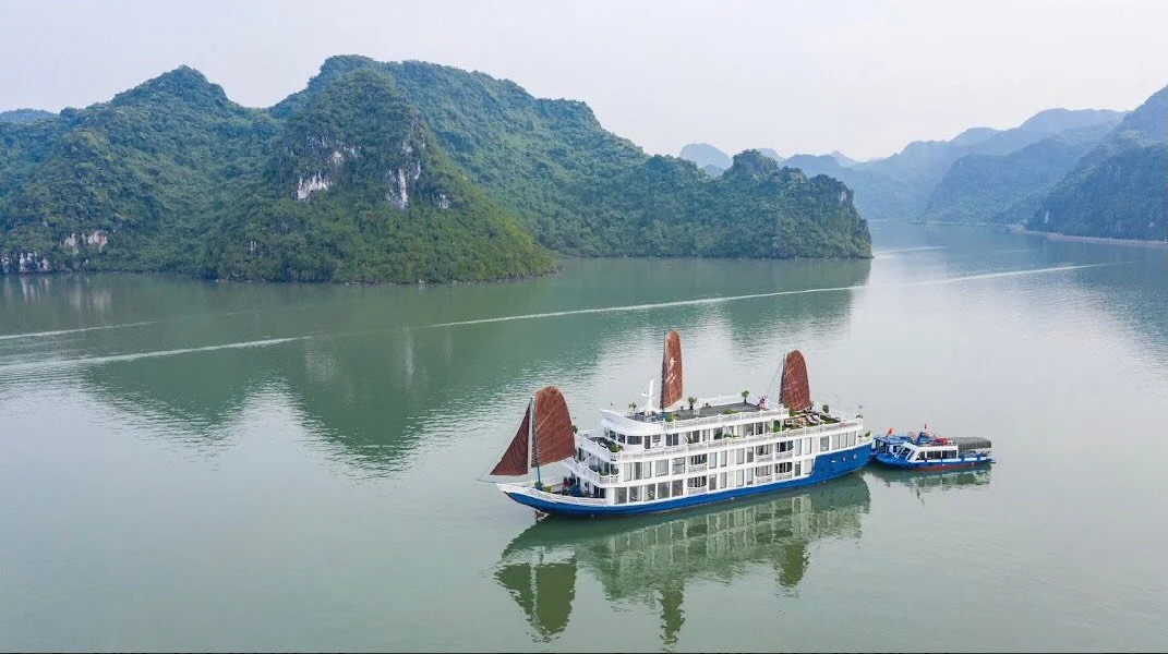 Boat cruising through Ha Long Bay