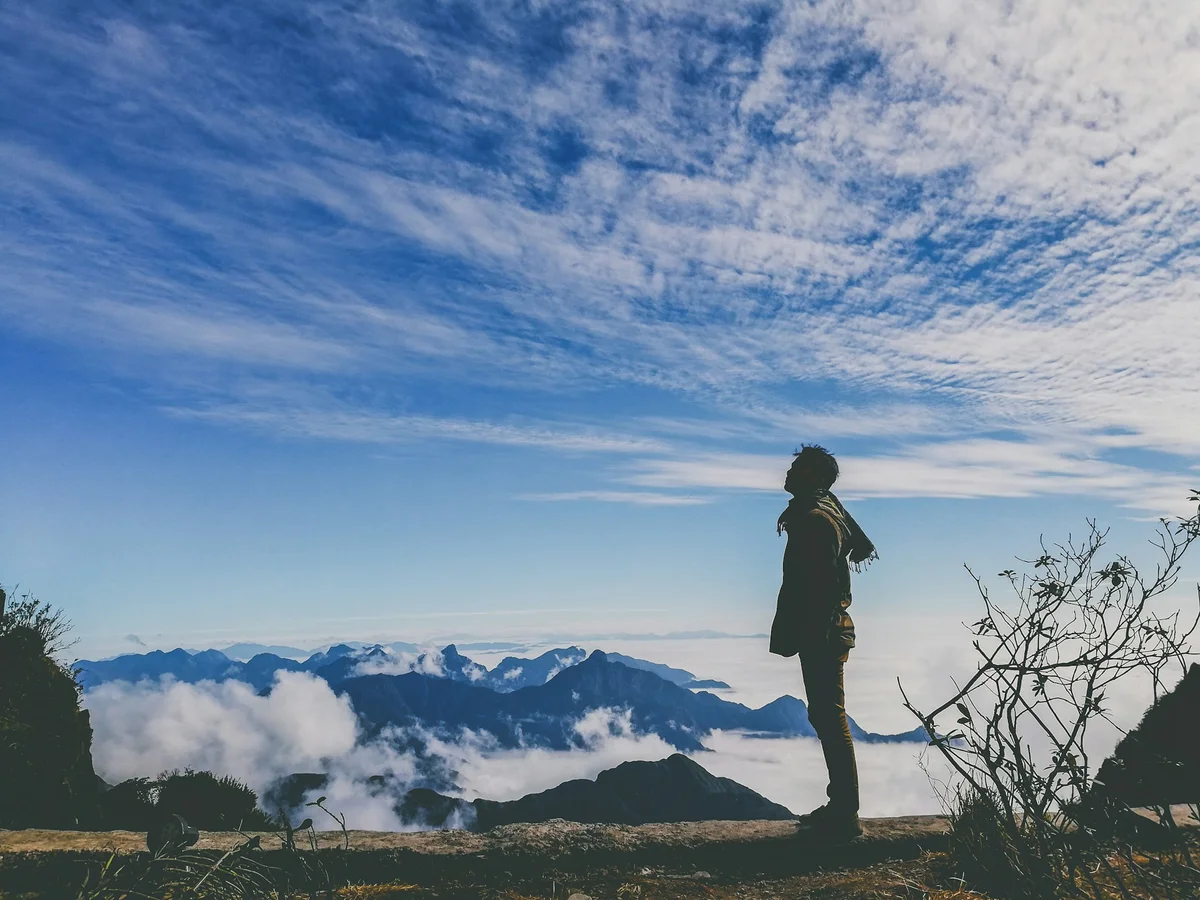 Man above the clouds after trekking in Sapa