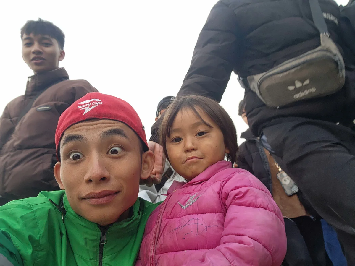 Easy rider poses for a picture with a young child 