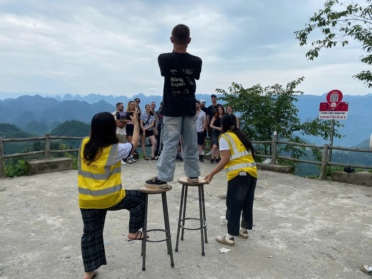 Ha Giang Loop Easy Rider taking a picture of his guests 