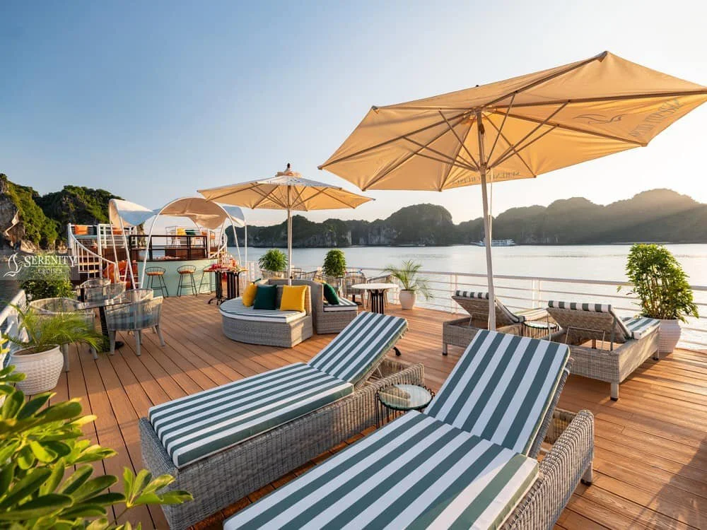 Sun loungers on a cruise desk, view of ocean behind