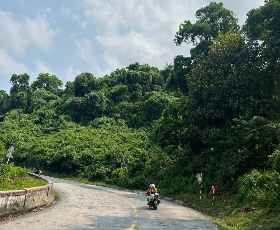 Girl on motorbike on winding road