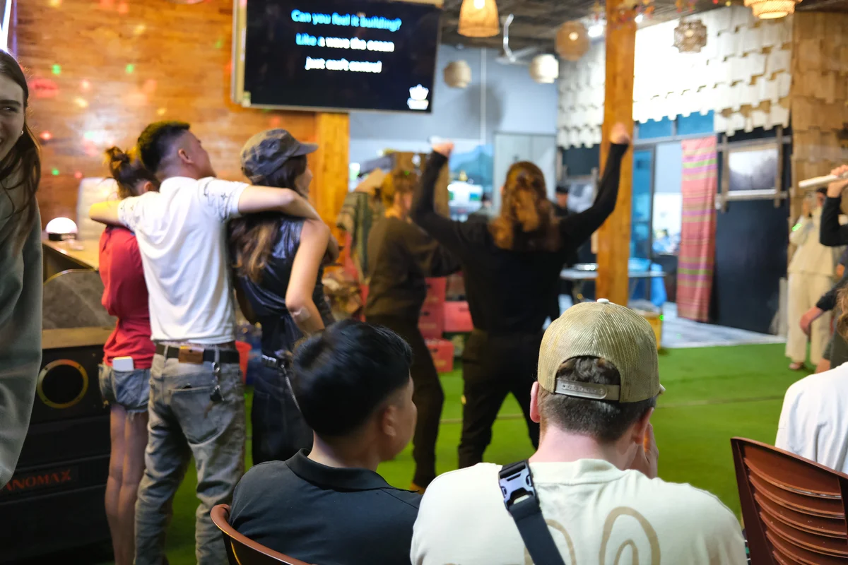 Guests singing karaoke on the Ha Giang Loop with Bong Hostel