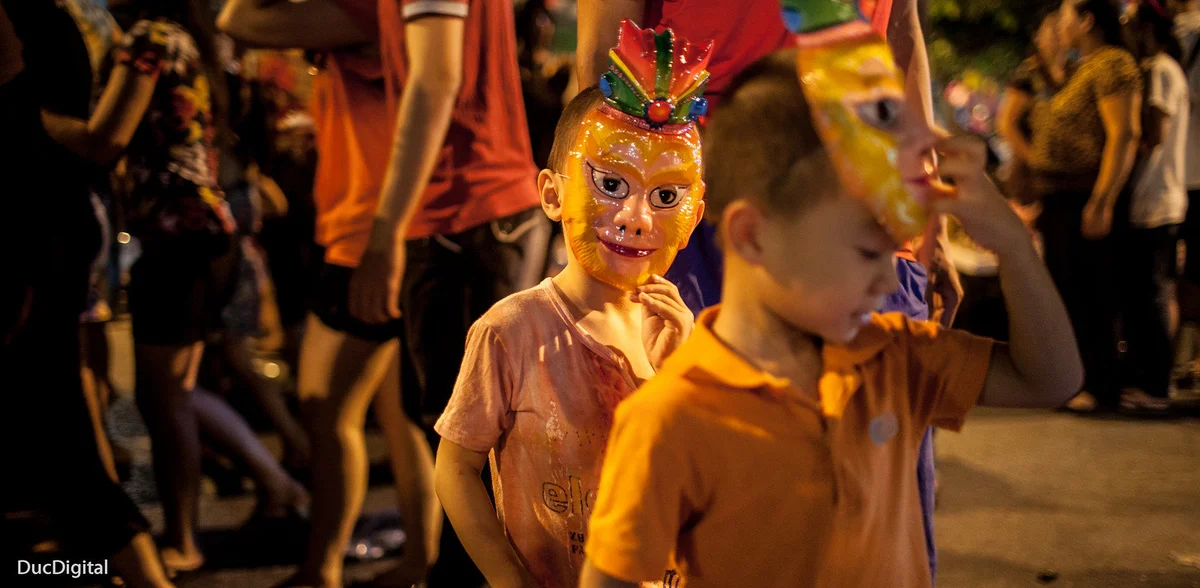 Children with masks on celebrating
