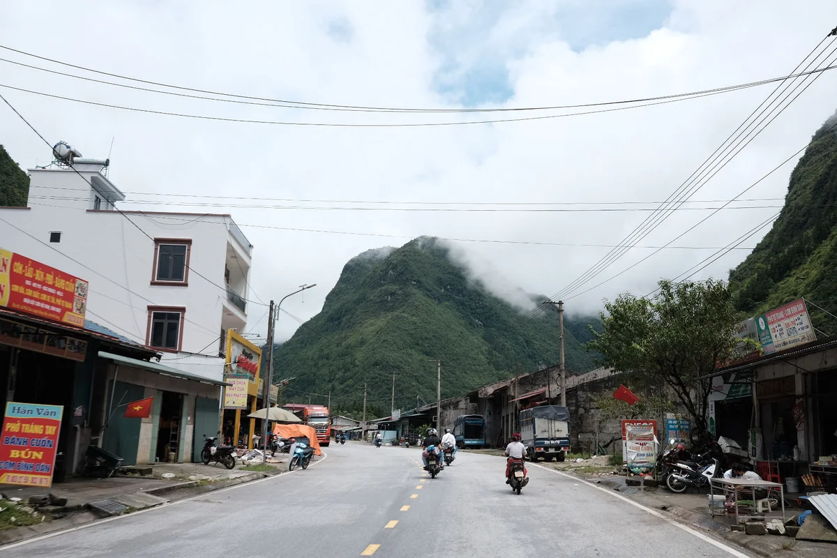 Motorbikers driving through a remote town