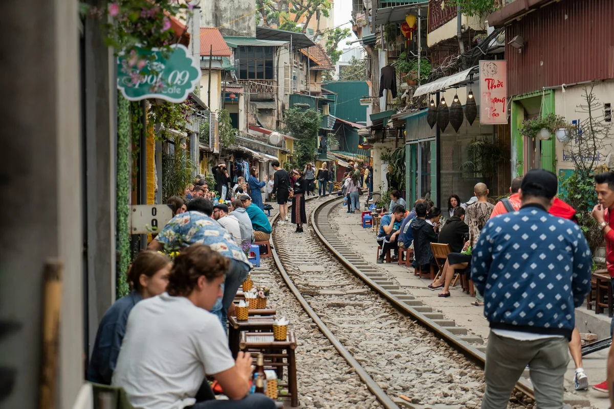 Watch the train come through hanoi train street as one of 15+ Free Things to do in Hanoi
