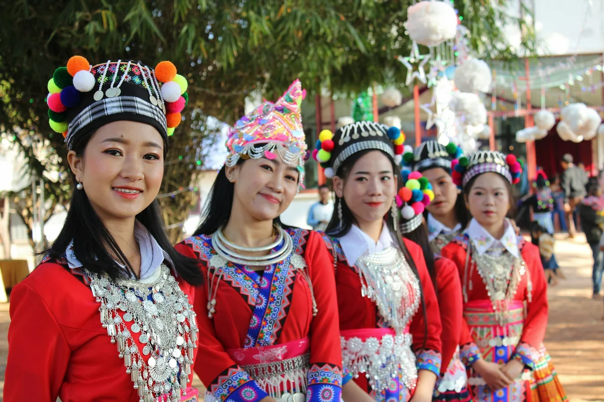 Laos women in Hmong dress and smiling