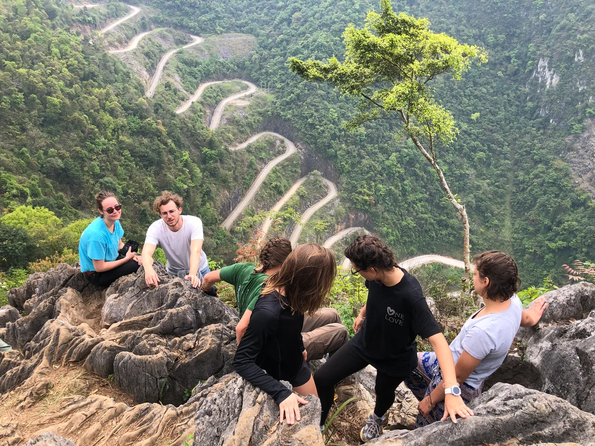 Guests posing at the Ma Pi Leng Pass, Cao Bang