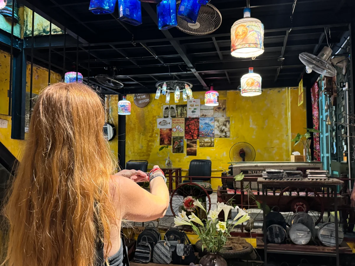 Girl takes a picture in a cafe in Hanoi