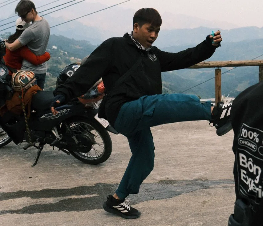 Bong Hostel Tour Leader playing Da Cau on the Ha Giang Loop
