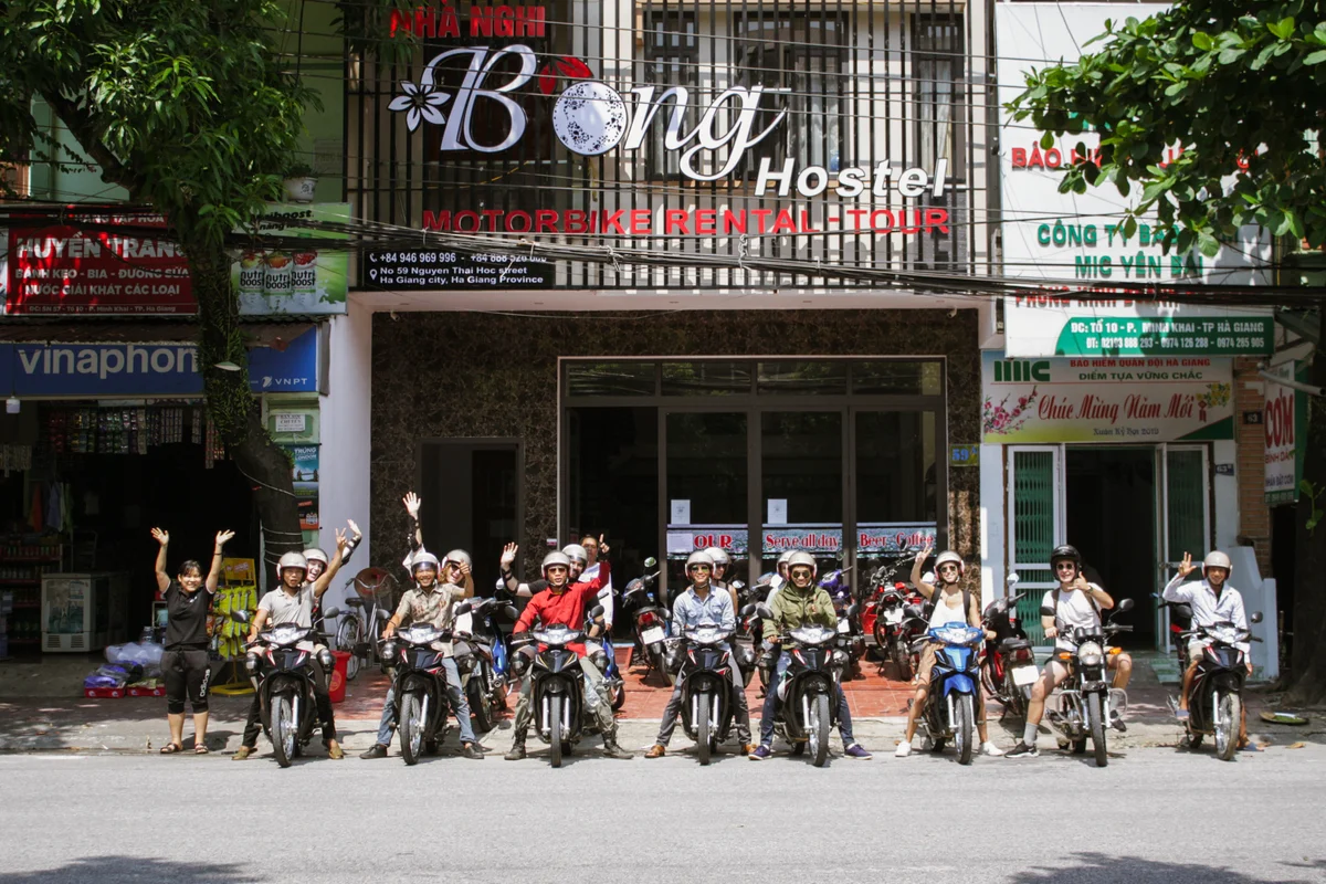 group tour about to depart outside Bong Ha Giang Hostel