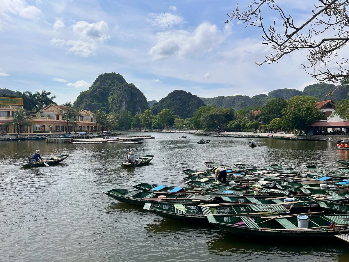 Lake with sampan boats and karst mountains