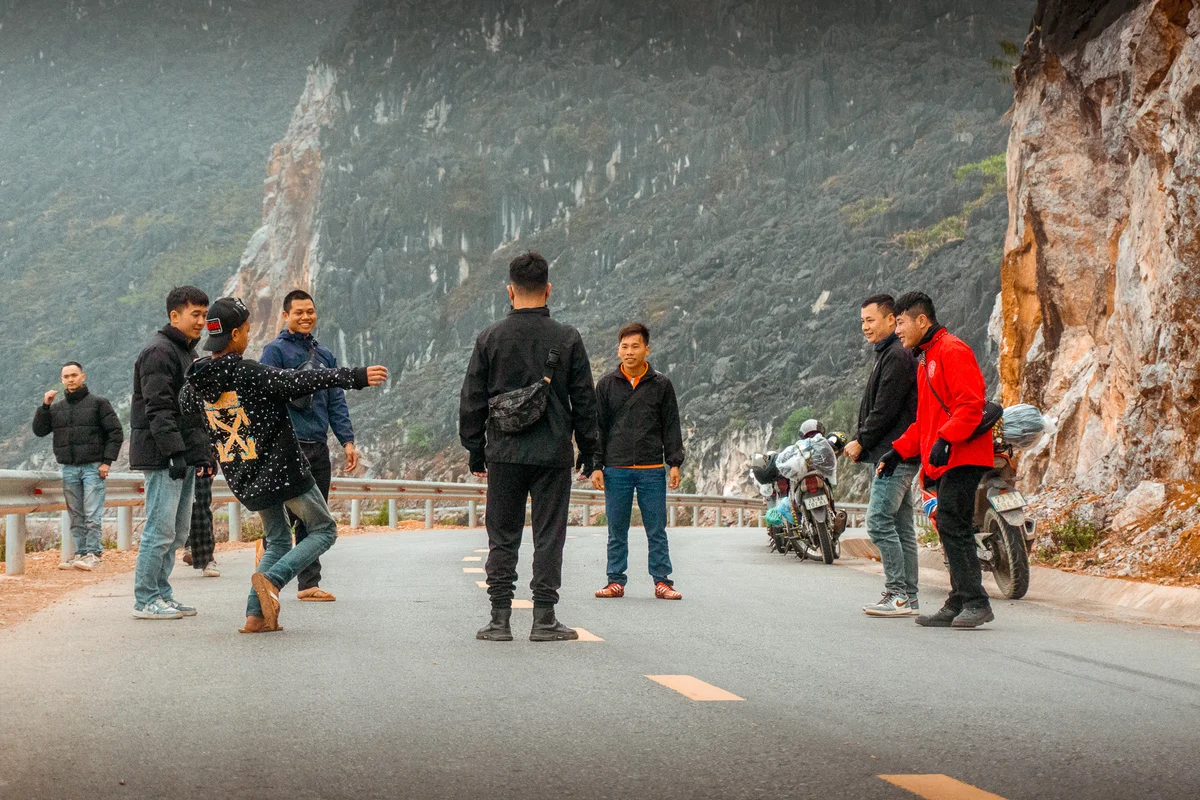 A group of Bong Hostel easy riders playing a game of Da Cau