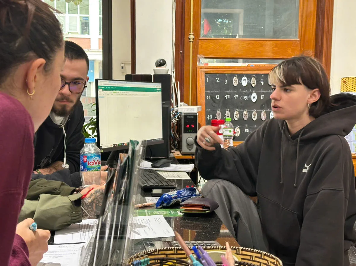 Volunteers helping with guest check ins at Bong Hostel