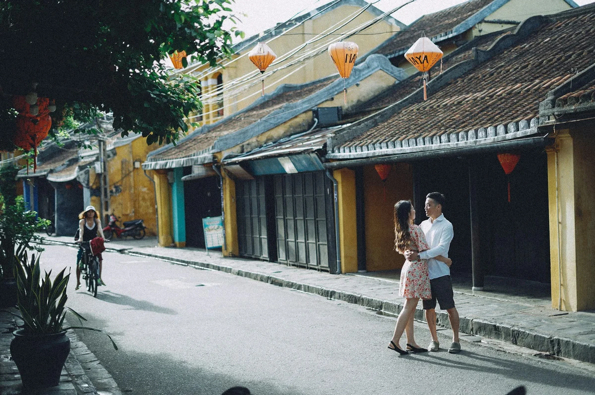 A man and a woman walking down a street